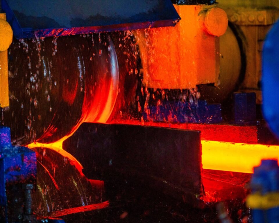 Molten steel being poured into a mold in a steel mill