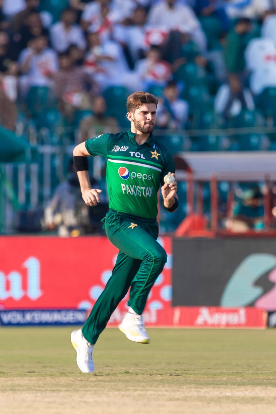 Pakistani fast bowler Shaheen Afridi runs in to deliver a ball during an Asia Cup match.