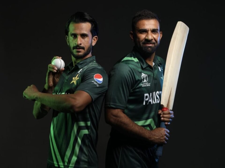 Dramatic low-key studio portrait of Pakistani cricketers Hassan Ali and Iftikhar Ahmed in official green World Cup jerseys, photographed by AHSANZ.