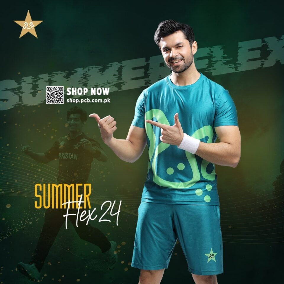 A vibrant turquoise and lime green, short-sleeved sportswear shirt and matching shorts, featuring a large, stylized, abstract graphic. The athletic set is modeled by a smiling South Asian man with dark hair and a beard, who is pointing enthusiastically with both hands. He is wearing a white wristband. The background is a moody, dark green and black with abstract graphics, and promotional text that says "SUMMER FLEX 24" and "SHOP NOW https://www.google.com/search?q=shop.pcb.com.pk". Editorial fashion photography by AHSANZ.